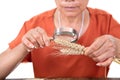 Agricultural experts hold a magnifying glass to view the mature wheat ears sampled Royalty Free Stock Photo