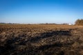 Agricultural field with bare soil in wintertime in Poland. Royalty Free Stock Photo