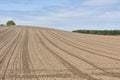 Agricultural field ploughed in spring. Arable land ready for the next cultivation season. Royalty Free Stock Photo