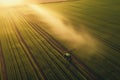 Agricultural field, the tractor cultivates crops, the view from above.