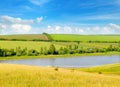 Agricultural fields, meadows, lake and sky Royalty Free Stock Photo