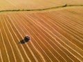 Agricultural harvester in a field of wheat Royalty Free Stock Photo