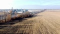 Agricultural industrial landscape. Plowed field, harvesting dry wheat, elevator Royalty Free Stock Photo