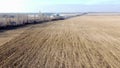 Agricultural industrial landscape. Plowed field, harvesting dry wheat, elevator Royalty Free Stock Photo