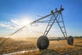 Agricultural irrigation on harvested wheat stubble field Royalty Free Stock Photo