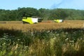 Two agricultural machines operate in the field, grain harvesting machines operate in the field, agricultural land Royalty Free Stock Photo