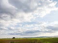 Agricultural land and clouds in the sky - Landscape in Maramures, Romania