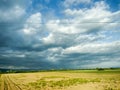 Agricultural land and clouds in the sky - Landscape in Maramures, Romania