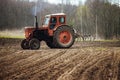 Agricultural land in the fieldagricultural tractor plows the land