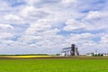 Agricultural lands: granaries and fields with different crops Royalty Free Stock Photo