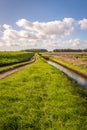 Agricultural landscape with narrow path and ditch