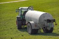 Agricultural machine in the farm watering and fertilizing the land with liquid animal manure
