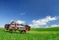 Agricultural machine on a green pasture