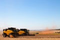 Agricultural machine harvesting soybean field. Royalty Free Stock Photo