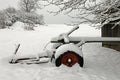 Agricultural machinery on a farm covered with snow Royalty Free Stock Photo