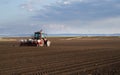 Tractor and seeder for sowing corn