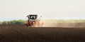 Tractor and seeder for sowing corn