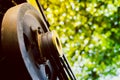 Agricultural machinery on a warm summer day. Driven pulley of a walk-behind tractor with two belts close-up on a blurred Royalty Free Stock Photo