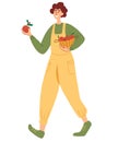 Agricultural man with baskets full of apples. Young Man Carrying Wicker Basket Full with Gathered Apples. The concept of fresh