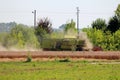 Agricultural old vintage combine harvester with hydrostatic drive and large capacity tank working in local field