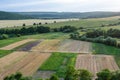 Agricultural Rolling Spring Autumn Landscape. Natural Landscape In Brown And Yellow Color. Waved Cultivated Row Field And Tree. Royalty Free Stock Photo