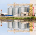 Agricultural Silo - Building Exterior, Storage and drying of grains, wheat, corn, soy, sunflower against the blue sky with Royalty Free Stock Photo