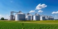 Agricultural Silos - Building Exterior, Storage and drying of grains, wheat, corn, soy, sunflower against the blue sky with rice Royalty Free Stock Photo