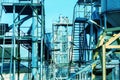 Agricultural Silos. Building Exterior. Storage and drying of grains, wheat, corn, soy, sunflower. Metal stairs and structures Royalty Free Stock Photo