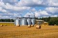 Agricultural silos. Building for storage and drying of grains, wheat, corn. Grain elevator. Agribusiness concept Royalty Free Stock Photo