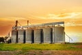 Agricultural silos at sunset