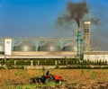 Agricultural silos with thick smoke from pipe emissions pollutio Royalty Free Stock Photo