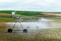 An agricultural center pivot sprinkler irrigating a field of potatoes in Idaho. Royalty Free Stock Photo