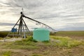 Agricultural sprinkler and fertigation tank. Royalty Free Stock Photo