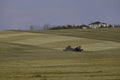 Agricultural tractor in a farm field preparing for planting Royalty Free Stock Photo