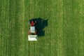 Agricultural tractor fertilizing wheat crop field with NPK Royalty Free Stock Photo