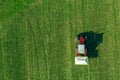 Agricultural tractor fertilizing wheat crop field with NPK Royalty Free Stock Photo