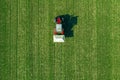 Agricultural tractor fertilizing wheat crop field with NPK Royalty Free Stock Photo