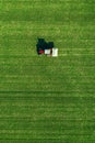 Agricultural tractor fertilizing wheat crop field with NPK Royalty Free Stock Photo