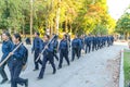 Agricultural university students in blue uniform and field hoe o