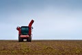 Agricultural vehicle harvesting sugar beet