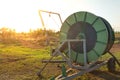 Agricultural water pipeline at farm with sunset.