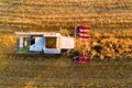 Closeup of combine harvester harvesting corn in the evening in the field. Aerial view. Royalty Free Stock Photo