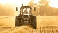 Agricultural work on the harvesting of hay by agricultural machinery.