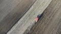 Agriculture - aerial view of harvest fields with tractor