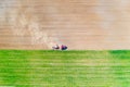 Agriculture in countryside concept. Cultivating farmland. Tractor in field Royalty Free Stock Photo