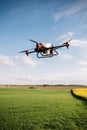 Agriculture drone fly to sprayed fertilizer on the rice fields. Industrial agriculture Royalty Free Stock Photo