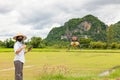 Agriculture farmer woman holds tablet to view a report on rice agriculture field, agriculture technology concept. Agriculture Royalty Free Stock Photo