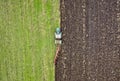 Agriculture. Farming. Tractor working in field. Aerial view. Tractor cultivating field. Royalty Free Stock Photo