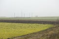 Fresh plowed agriculture field and a grain field 