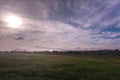 Agriculture field with thick mists of fog at the crack of dawn Royalty Free Stock Photo